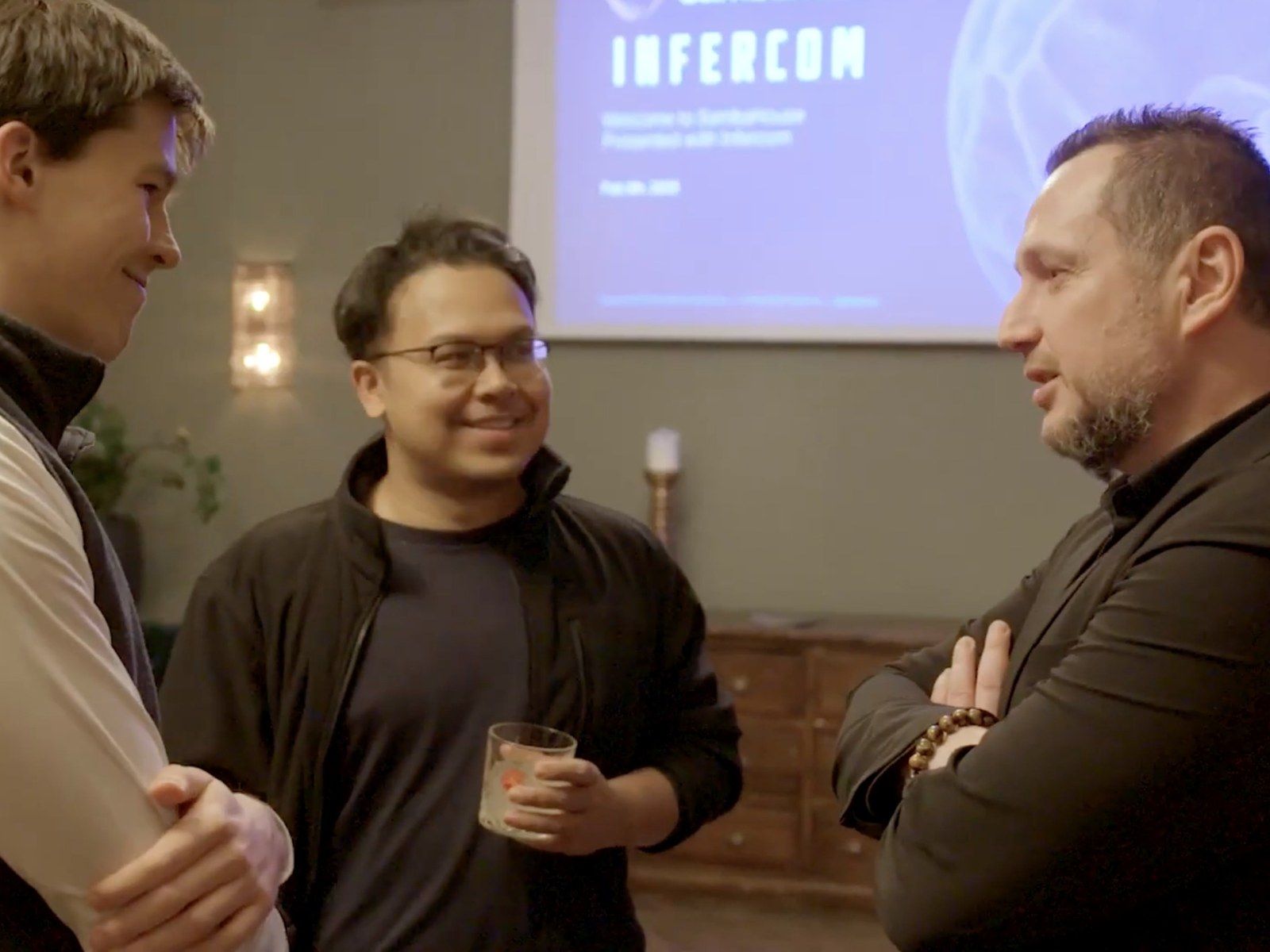Altug Eker, Managing Director of Infercom, in conversation with two partners at SambaHouse Berlin